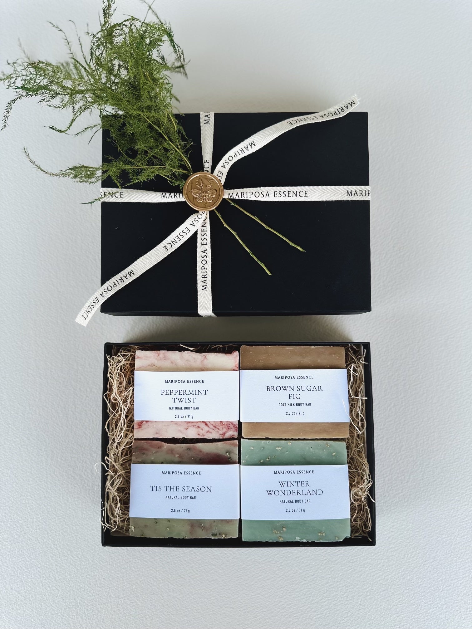 Tis the Season Body Bar sampler giftwrapped with butterfly gold seal and dried winter greens