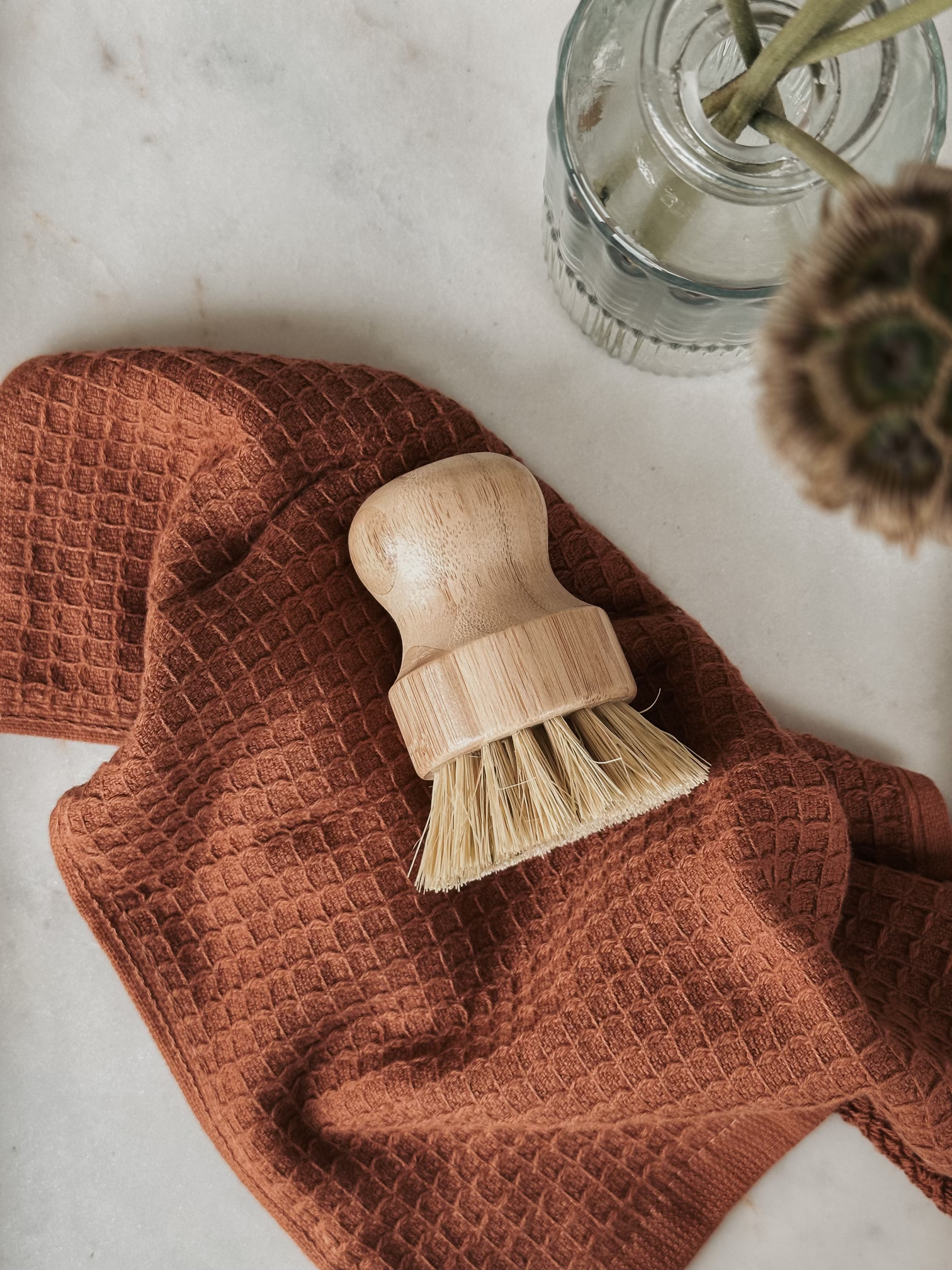 Cleaning Brush displayed on a rust towel