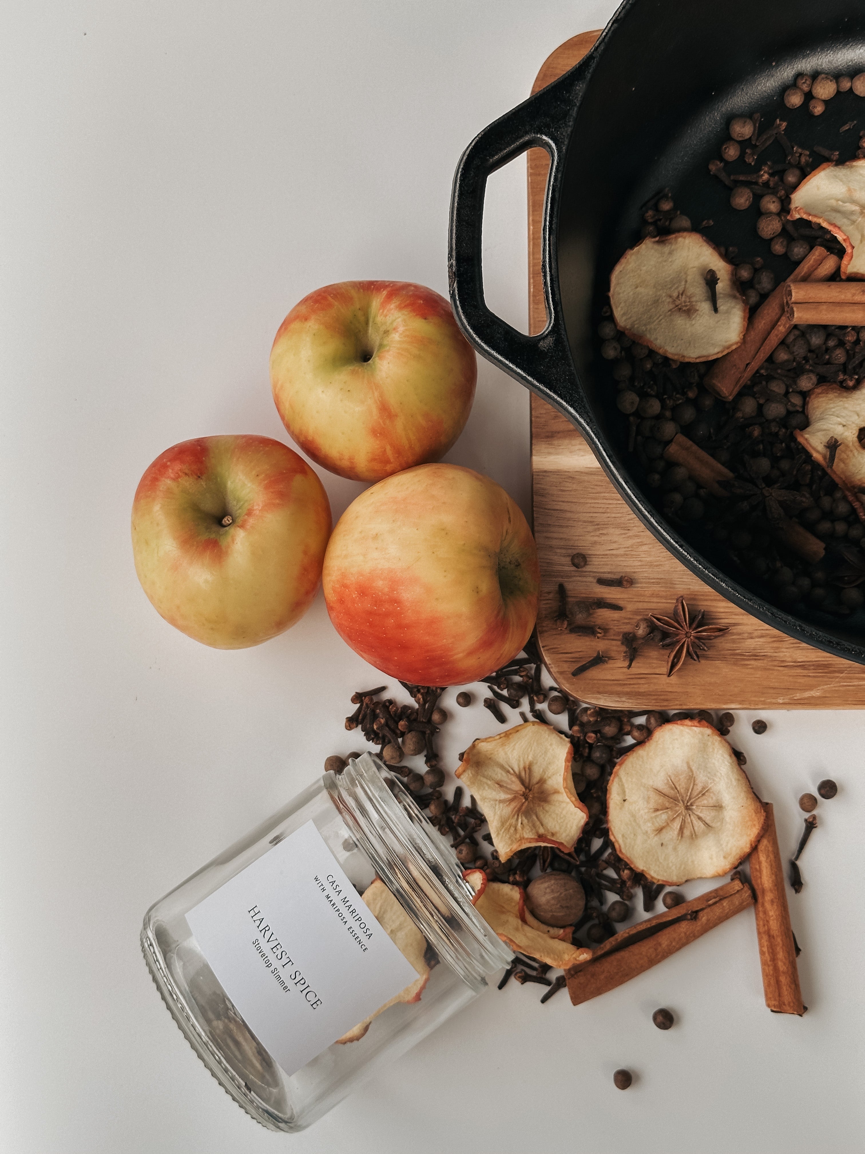 Harvest spice stove top simmer displayed with apples and spices.