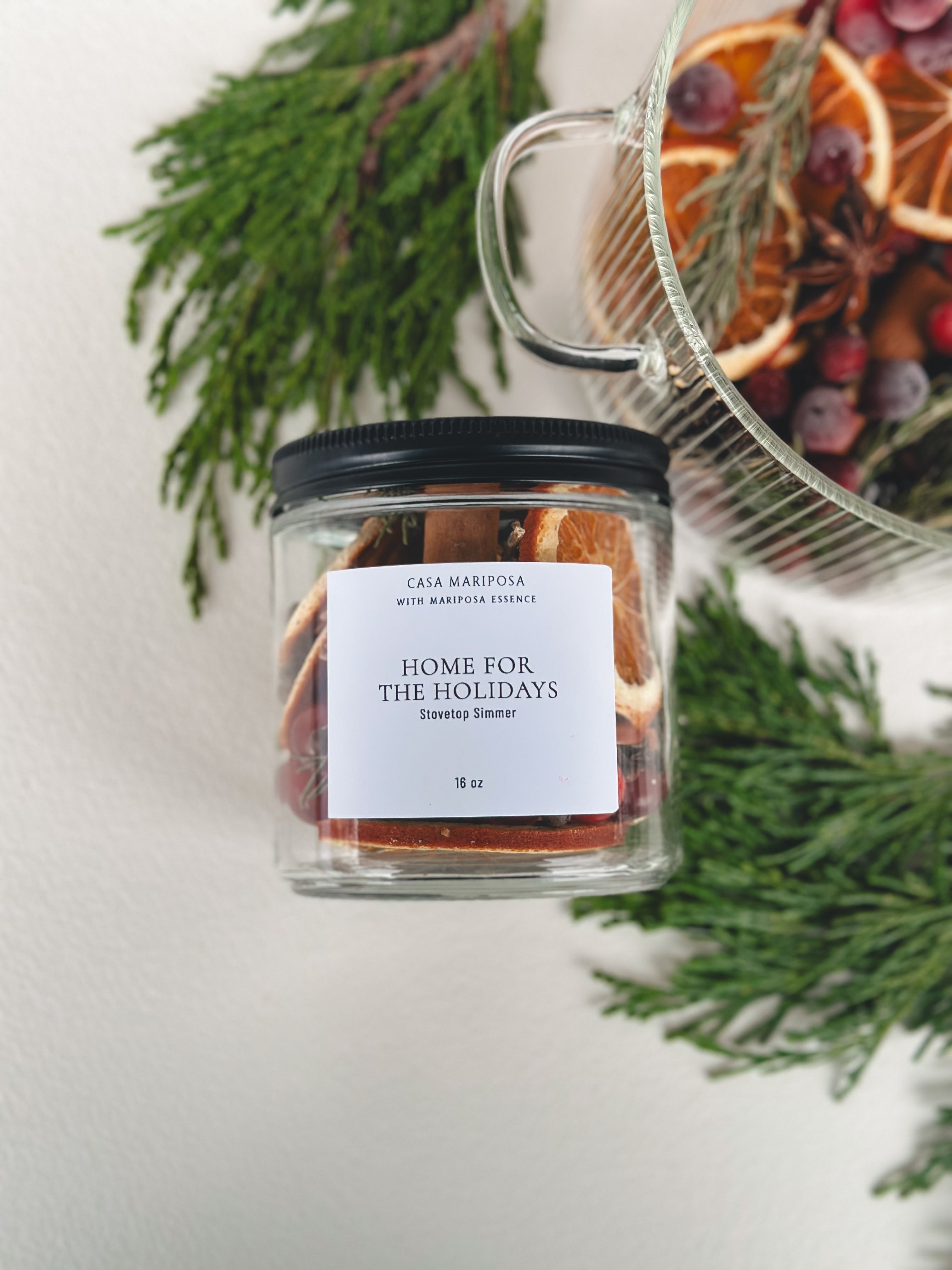 Home for the holidays stovetop simmer displayed with clear pot and cedarwood
