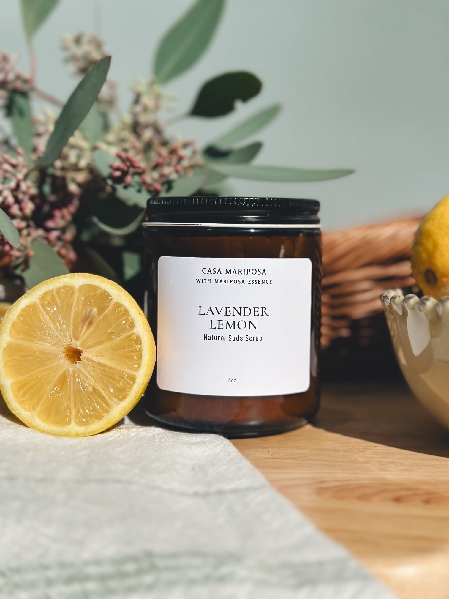 Lavender Lemon Suds Scrub displayed with lemons