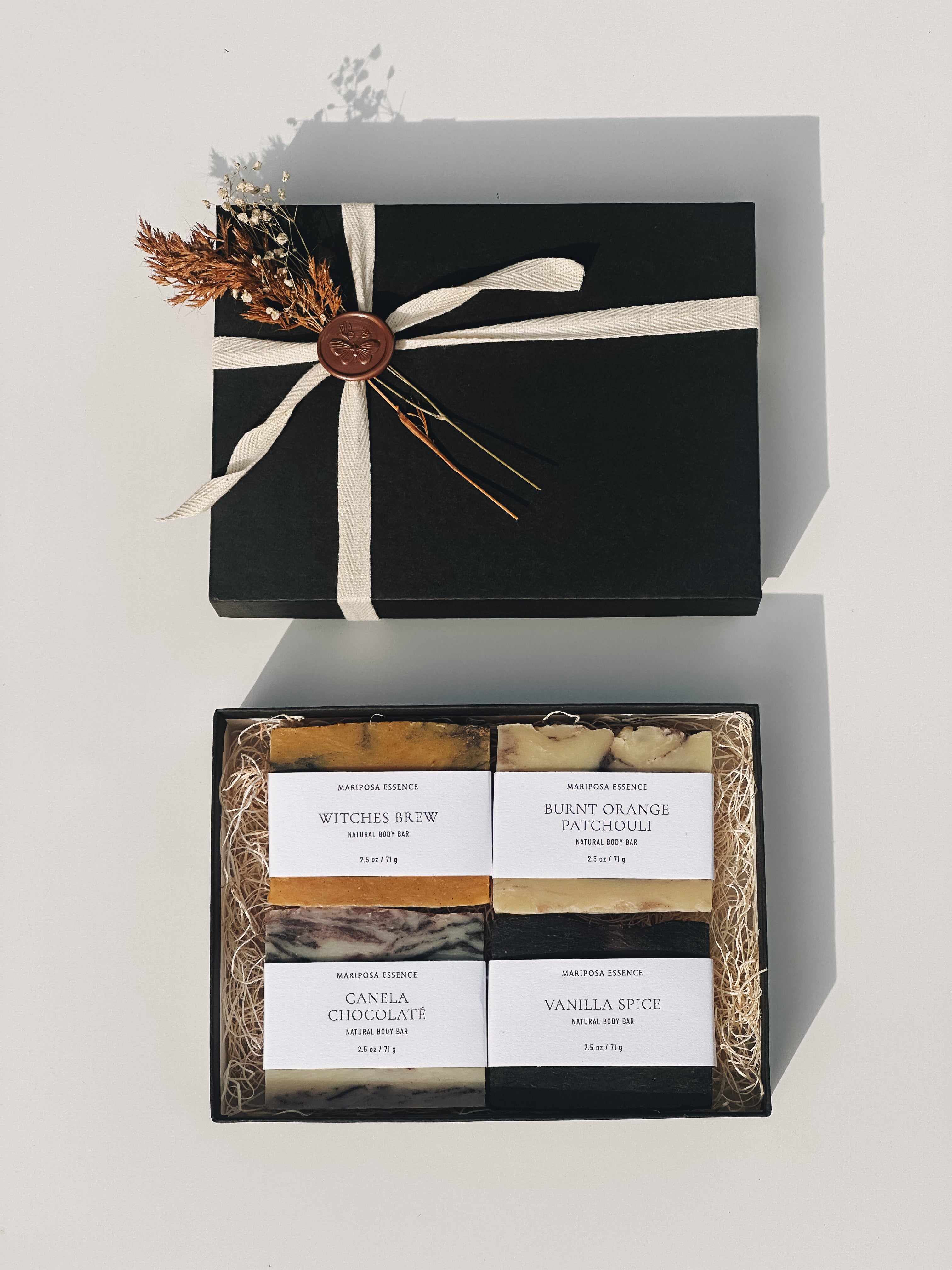 Autumn Body Bar sampler displayed in a black box with dried floral and ribbon.